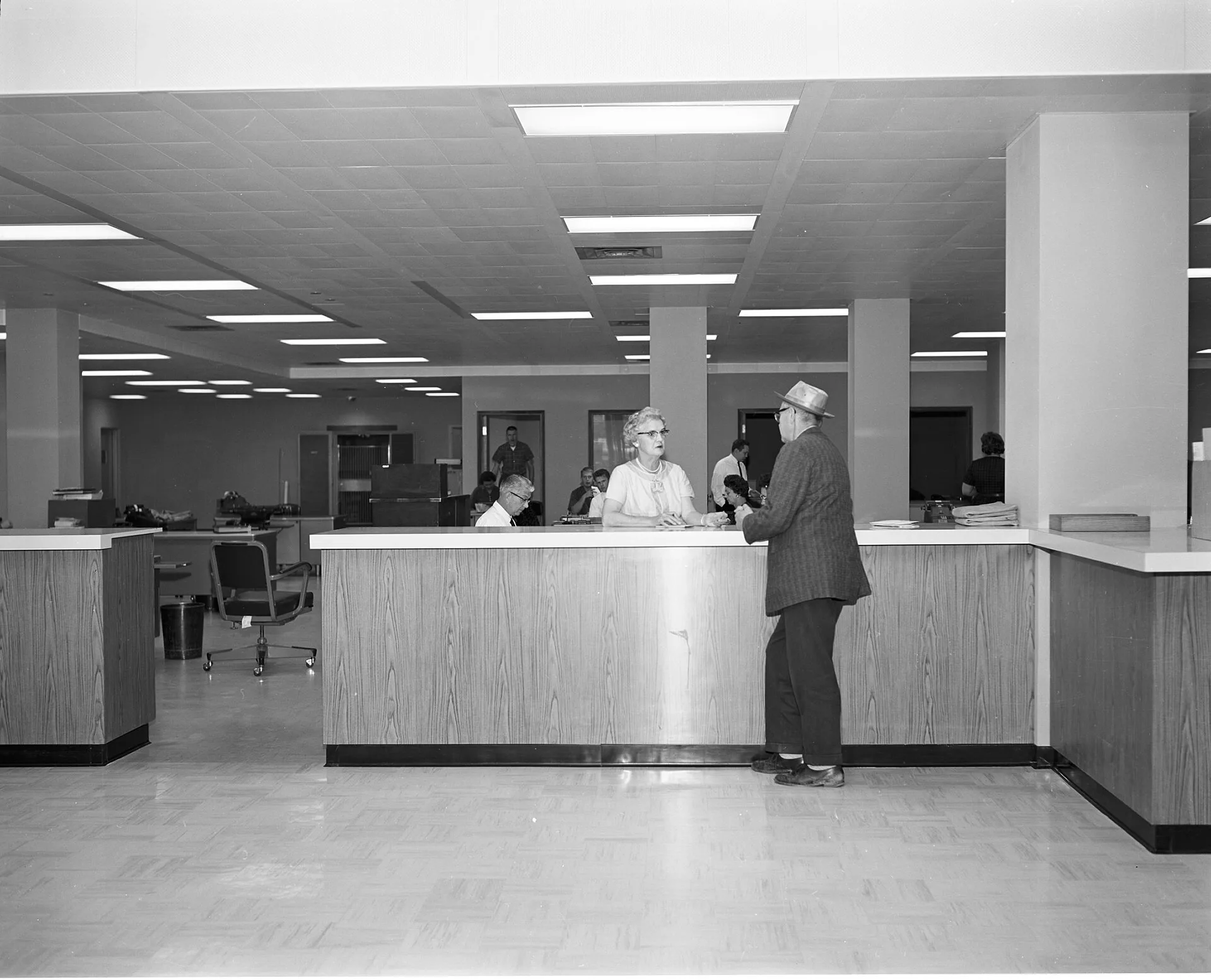 Customer service counter in the then-new Seattle Municipal Building, 1962. The building was demolished in 2003. Administration careers: five forms the work takes