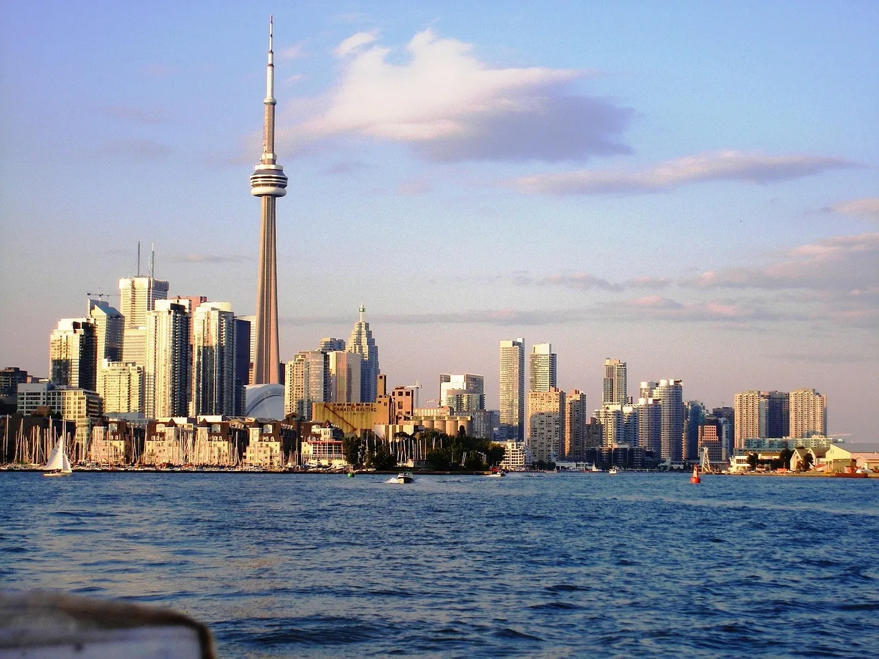 toronto, skyline, nature, cityscape, skyscraper, urban, business, lake, panorama, sky, clouds, harbourfront, highrise, waterfront, canadian, ontario, canada, blue business, blue company. Marketing Salary in Canada: Toronto, Vancouver, and Montreal Compared